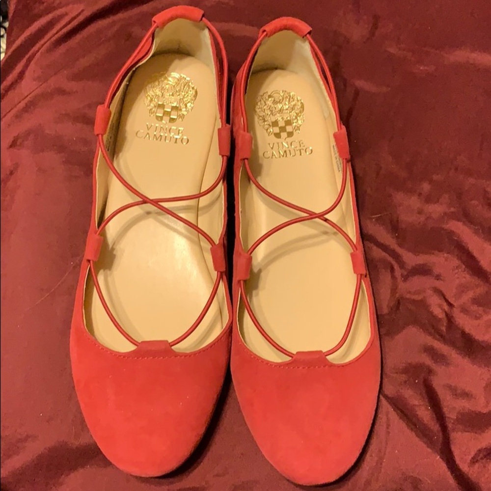 Vince Camuto red flats with straps.